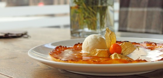 Tarte Tatin with apples and ice cream decorated with cape gooseberry
